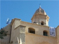 Italcementi, operai sopra il campanile del Duomo di Sassari